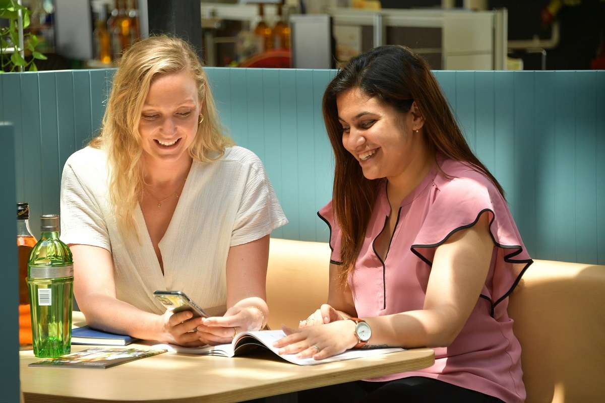 Women sharing a table in the Diageo office