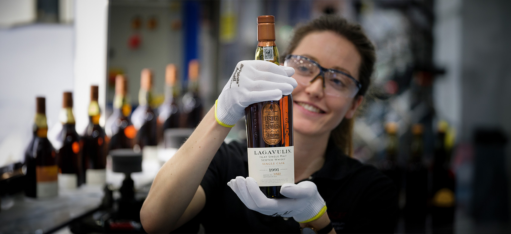 woman holding a scotch whiskey